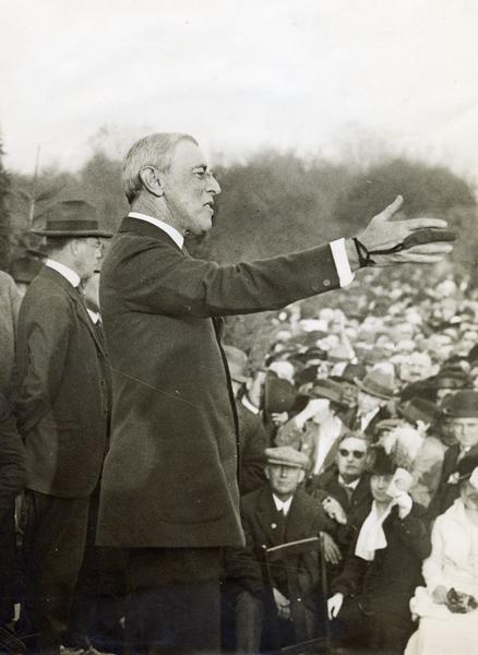 Woodrow Wilson campaigning for his second term as president. He is wearing a leather finger protector due to injury from too many handshakes that accompanied his speeches.
