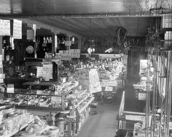 Counters and display cases show goods for sale in the General Store.