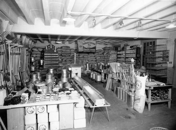 The interior of the Southern Wisconsin Produce Company, venders of farming and gardening tools and supplies.