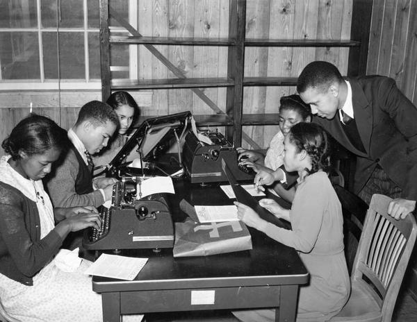 African American students work on a school paper as part of the Farm Security Administration sharecropper resettlement project.