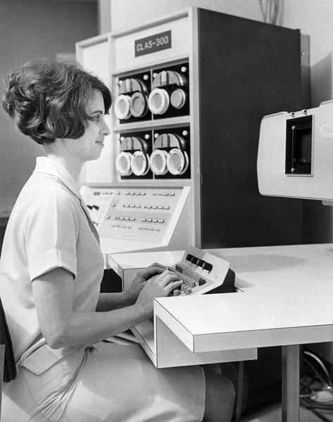 A secretary in the pathology department at St. Joseph's Hospital working at a new computer.