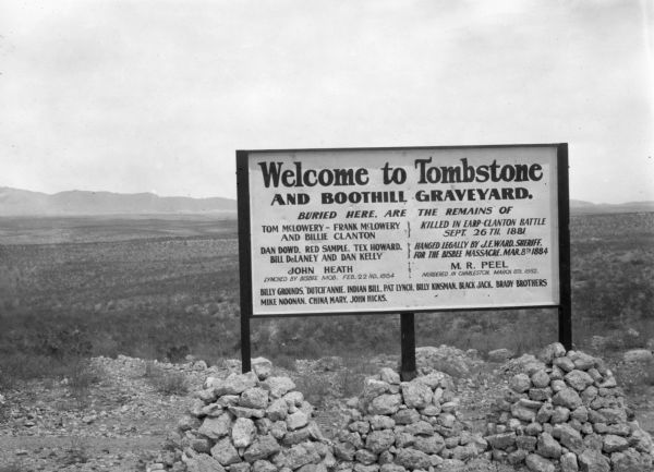 Sign welcoming visitors to Tombstone, Arizona and the cemetery where members of the Clanton gang that were killed in the Earp-Clanton battle September 26, 1881 are interred.