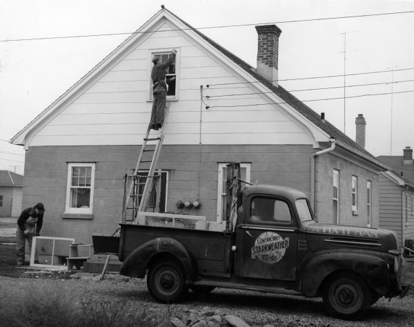 Workers from Starkweather Contractors repair and install windows at a residence.