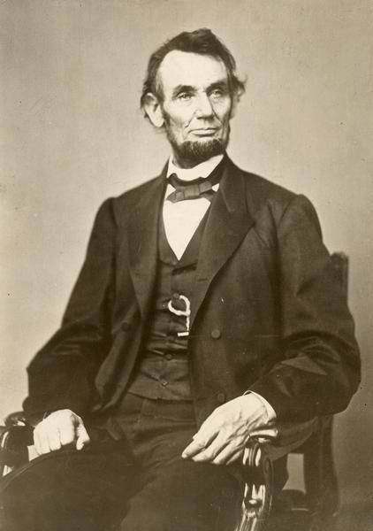 Formal portrait of Abraham Lincoln, seated.