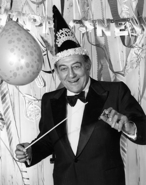 Portrait of Guy Lombardo, bandleader of the Royal Canadians. He and his orchestra were famous for their traditional performance on New Year's Eve at the Waldorf Astoria Hotel in New York City.
