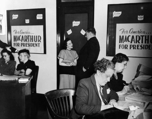 Men and women work at the campaign headquarters for the Douglass MacArthur campaign for president.