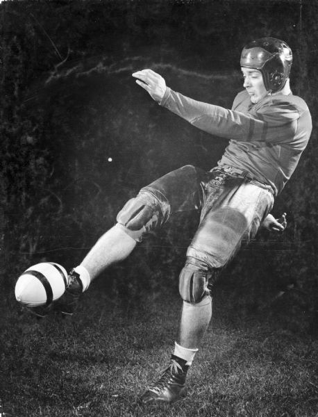 A man dressed in a football uniform demonstrates the art of drop-kicking the football.  This is one of several demonstrations of strobe light functions at Frank Scherschel's Strobo Research Lab.