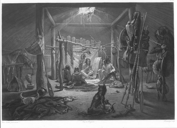 Interior of the hut of a Mandan chief showing various objects and animals with five Mandans seated on ground.
