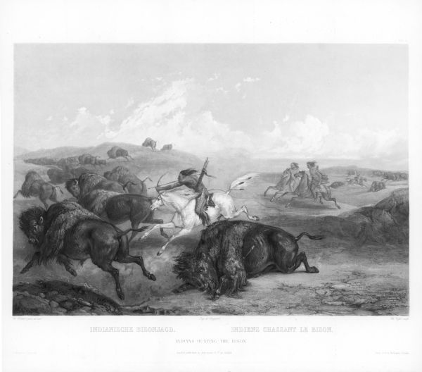 Indians on horseback hunting bison.