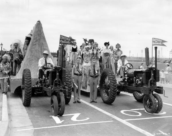 Farmall F-12 tractors pulling parade floats at the Texas Centennial.