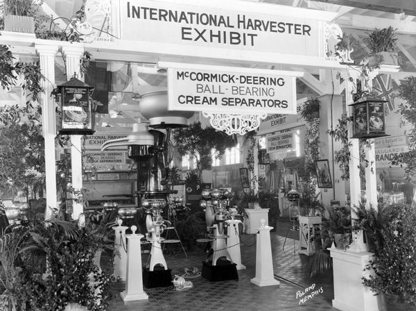 International Harvester's exhibit of McCormick-Deering ball-bearing cream separators at the National Dairy Show. The exhibit features a giant demonstrator cream separator.