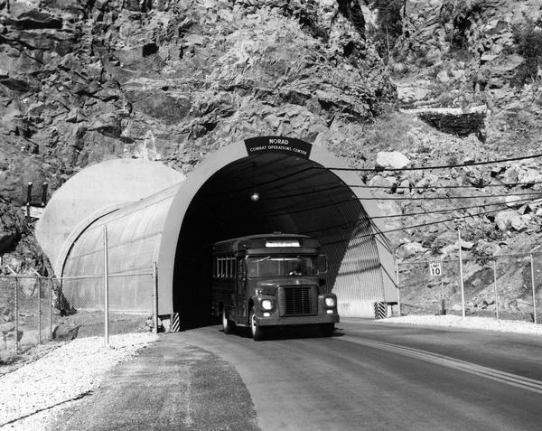 International transit bus emerges from a tunnel leading to the interior of the North American Air Defense Command's (NORAD) Combat Operation's Center in Cheyenne Mountain.