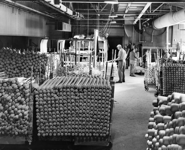 Interior of Adirondack Bats, Inc. baseball bat plant. These bats, made from New York and Pennsylvania white ash, received their final finish and are ready for labeling and then shipment to distributors.