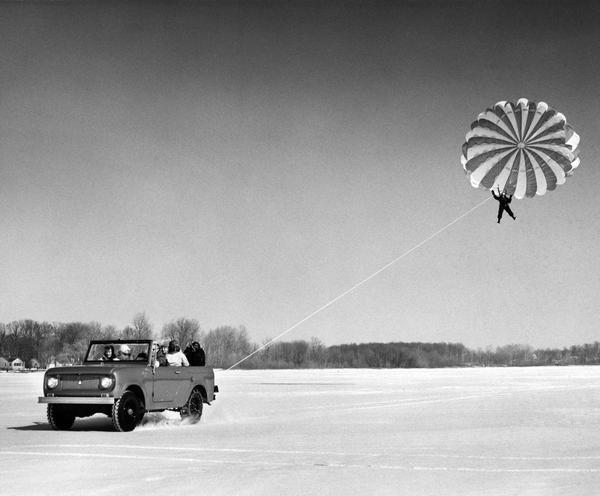 Morris Hults, 39, of Churubusco, Indiana, "para-kiting" behind International 4x4 Scout pickup on an ice and snow-covered Blue Lake, near his hometown.