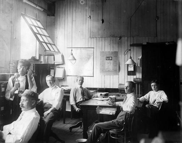 Office workers at International Harvester's Akron Works. The works originally belonged to the Aultman & Miller Buckeye Company until it was bought out by IHC in 1905. Retooled and modernized in 1907, the works unfortunately burned and was rebuilt in 1912. Occupying 11.5 land acres, the works closed in 1919 when truck manufacturing was moved to Springfield Works. Products manufactured: harvesters (Buckeyes, until 1906 or so), auto wagons, commercial cars, motor truck parts, tractors (until 1911).