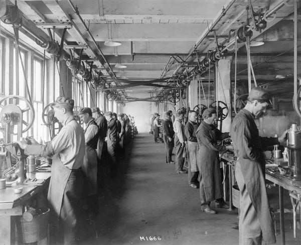 Employees working on cream separator(?) components at International Harvester's Milwaukee Works. The factory was owned by the Milwaukee Harvester Company until 1902.