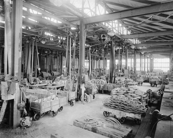 Grinder room filled with cartloads of parts at International Harvester's Milwaukee Works. The factory was owned by the Milwaukee Harvester Company until 1902.