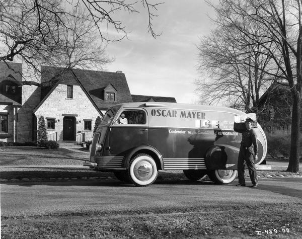 Man delivering a block of ice to a residential home (150 Lakewood Blvd.) using an International D-300 Oscar Mayer truck with special streamlined body. The home was owned by Jack Reynoldson, an Oscar Mayer employee. Oscar Mayer made and sold ice from about 1923 to 1968.