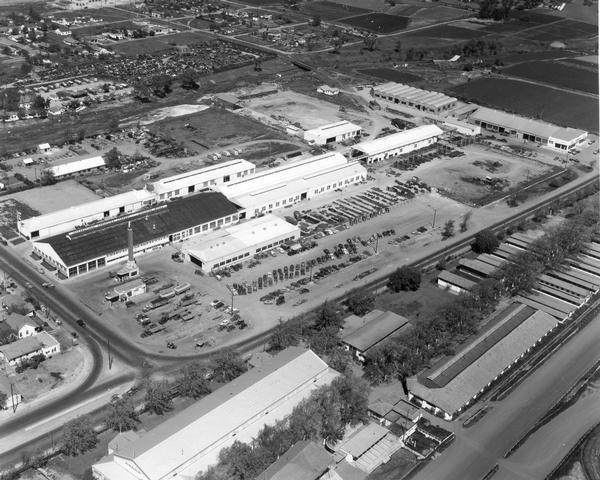 Aerial view of International Harvester's Stockton Works. The factory was originally owned and operated by the Dyrr Manufacturing Company and was in operation from 1947 to 1971. Products: disk harrows, heavy duty rakes, special west coast tools, carriers, cultivators, farm dozers, moldboard plows, pulverizers, subsoilers and pan breakers, toolbars and combinations.