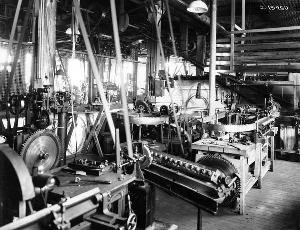 Saws blades and machinery in a saw blade sharpening and setting shop at International Harvester's Weber Works. The factory was located at Auburn Park and was owned by the Weber Wagon Company until 1904. International Harvester produced wagons at the factory until 1927.