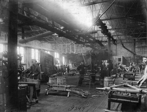 Workers assembling wagon chassis at International Harvester's Weber Works in Auburn Park. The factory was owned by the Weber Wagon Company until 1904 when International Harvester purchased it.