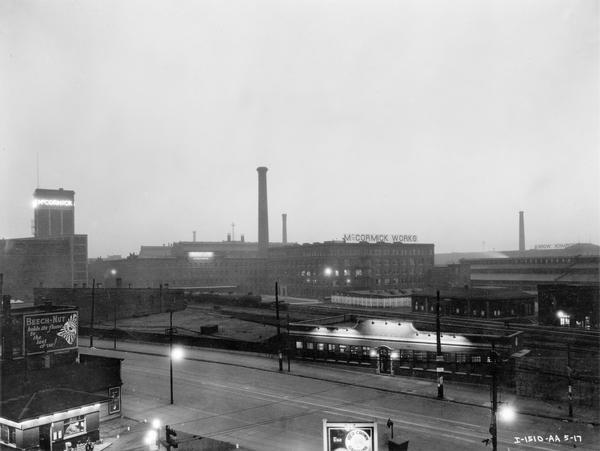 Elevated view of International Harvester's McCormick Works at dusk. The McCormick Works was built by Cyrus McCormick in 1873 and became part of International Harvester in 1902. The factory was located at Blue Island and Western Avenues in the Chicago subdivision called "Canalport." It was closed in 1961.