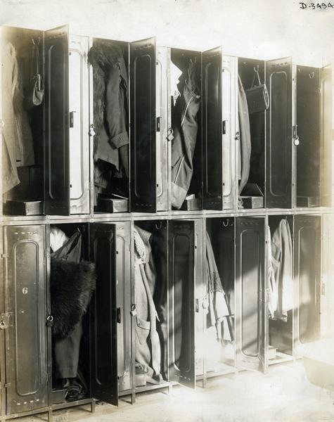 Women's coats, hats and other belongings hanging in lockers at International Harvester's Deering Works twine mill. The factory was owned by the Deering Harvester Company until 1902, when it became part of International Harvester Company.