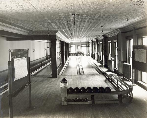 Three-lane bowling alley inside International Harvester's Deering Works. The factory was built by William Deering for the Deering Harvester Company in 1880 and became International Harvester's Deering Works in 1902. The factory was located at Fullerton and Clybourn Avenues, and closed in 1933.