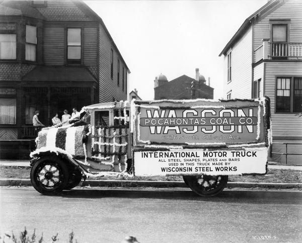 International heavy-duty coal truck owned by Pocahontas Coal Company decorated. Placard on truck reads: "International motor truck. All steel shapes, plates and bars used in this truck made by Wisconsin Steel Works."