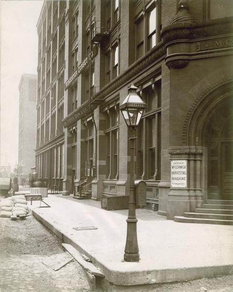 McCormick Harvesting Machine Company office building from the corner of Market and Jackson streets. The building's address was 212 Market Street. Offices for the Worcester Corset Company and Turner Bros. & Co. were in the same building. This building served as the McCormick Company's general office from 1885 to 1891.