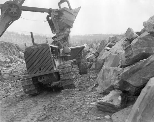 Original caption reads: "Model TD-65 Diesel TracTracTor [crawler tractor] owned by the Albert Brothers, and working on the Sky Line Drive. This tractor is hauling from the shovel with a Euclid Wagon." A handwritten note further states: "model # changed to TD-18; do not use!"