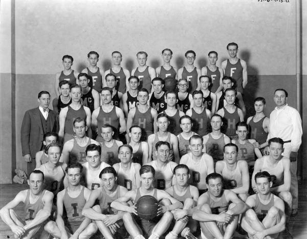 Group portrait of basketball teams from six International Harvester factories including Farmall Works, McCormick Works, Hamilton Works, and Deering Works. One of the remaining teams was likely from the company's Plano Works (a.k.a West Pullman).