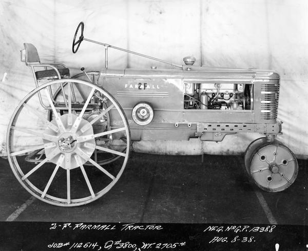 Engineering photograph of an experimental  Farmall tractor designated as model "2F". Right side view.