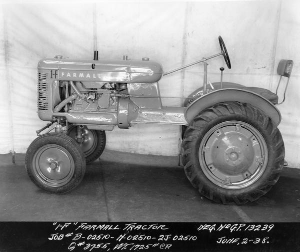 Engineering photograph of an experimental Farmall tractor designated as model "1-F". Left side view.