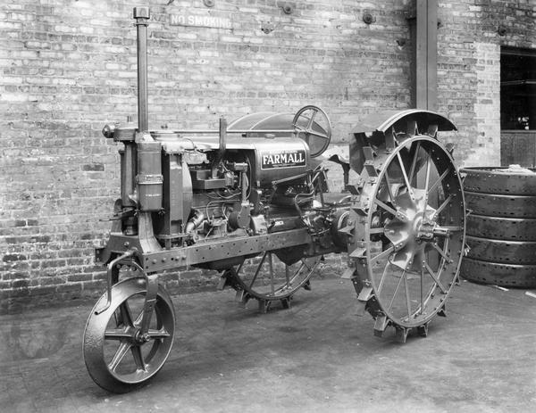 Engineering photograph of a Farmall F-12 tractor with specially designed single front wheel, fenders, and clutch.