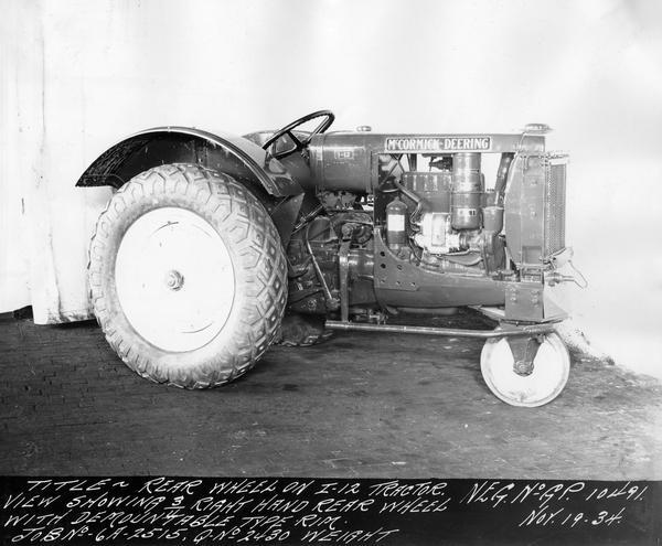 Engineering photograph of an experimental McCormick-Deering I-12 tractor with demountable type rear rims. Right side view.