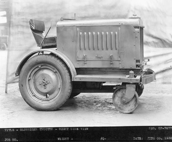 Engineering photograph of an experimental tractor or "shop mule" identified as a "Slonniger tructor." Right side view.