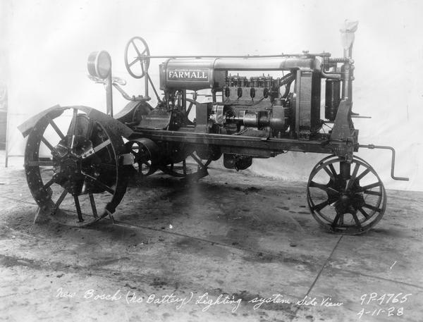 Engineering photograph of an experimental Farmall tractor with "new Bosch (no battery) lighting system." Right side view.