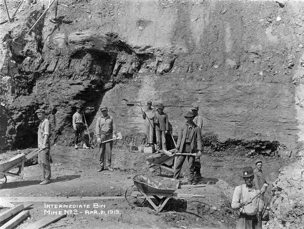 Workers digging an intermediate bin for mine no. 2. Benham was a "company town" created by International Harvester for the workers of the Wisconsin Steel Company. Wisconsin Steel was a subsidiary of International Harvester and operated coal mines at Benham.