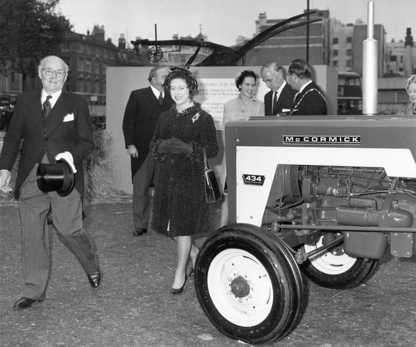 Service of Thanksgiving for the harvest at Westminster Abbey, London. Princess Margaret, Mr. Fred Peart, Minister of Agriculture (2nd right), and Mr. Hugh Edgson Wright, President of the Agricultural Engineers Association (extreme left), standing next to a British-made McCormick 434 tractor.