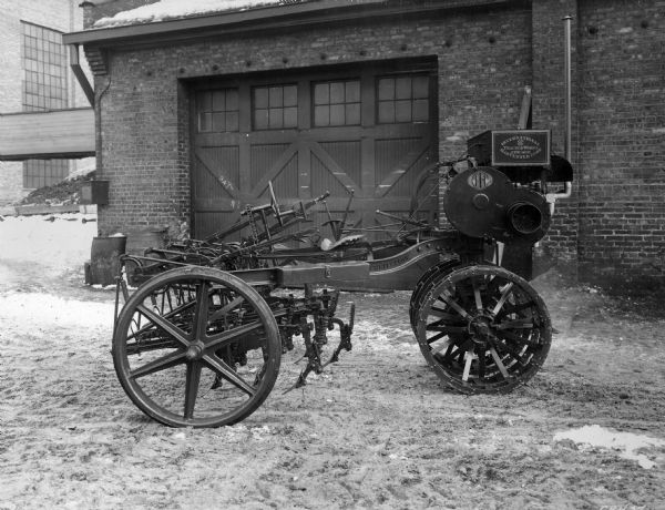 Engineering photograph of a limited production motor cultivator. Original caption reads: "The cultivator used in connection with this development was substantially the no. 5 two-row cultivator then in regular manufacture at West Pullman Works. Patent no. 1422985 covers features of this development. One hundred were built in 1917 and thirty-one were placed on farms. They were all recalled."