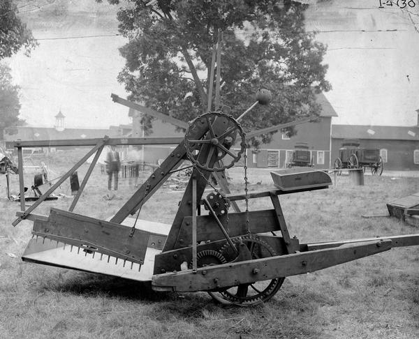 McCormick automatic self-rake reaper built in 1858 and patented by McClintock Young. Original caption reads: "This machine embodies the improvement of substituting an automatic rake for the rake on the machine."