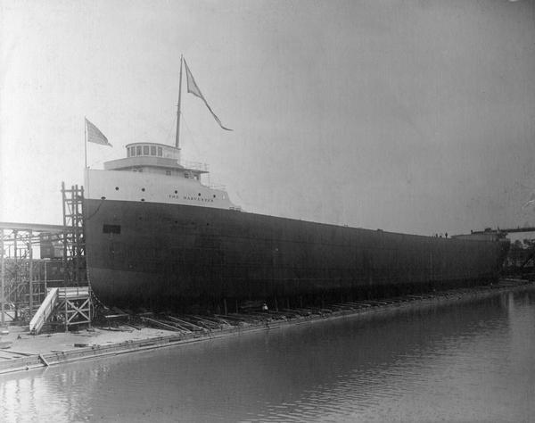 The S.S. <i>Harvester</i> on the building ways before launching. The ship was built for the Wisconsin Steel Company, a subsidiary of International Harvester. The 545-foot all steel freighter was built by the American Shipbuilding Company using the "Isherwood" system of design.