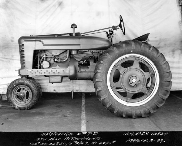 Engineering photograph of an experimental Farmall 3F tractor "with miscellaneous attachments."