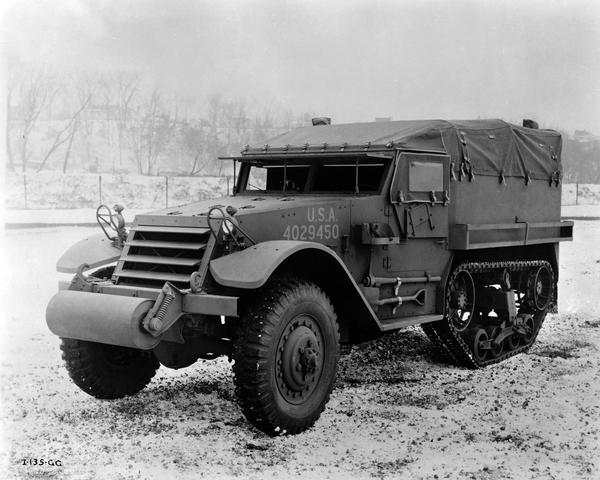 International M-5 half-track personnel carrier parked outdoors. Manufactured at International Harvester's Springfield Works for the U.S. military.