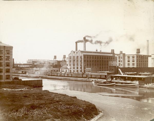 Southeast panorama of the McCormick Reaper Works, rail yard and canal. The factory was owned by the McCormick Harvesting Machine company before 1902. In 1902 it became the McCormick Works of the International Harvester Company. The factory was located at Blue Island and Western Avenues in the Chicago subdivision called "Canalport". It was closed in 1961.
