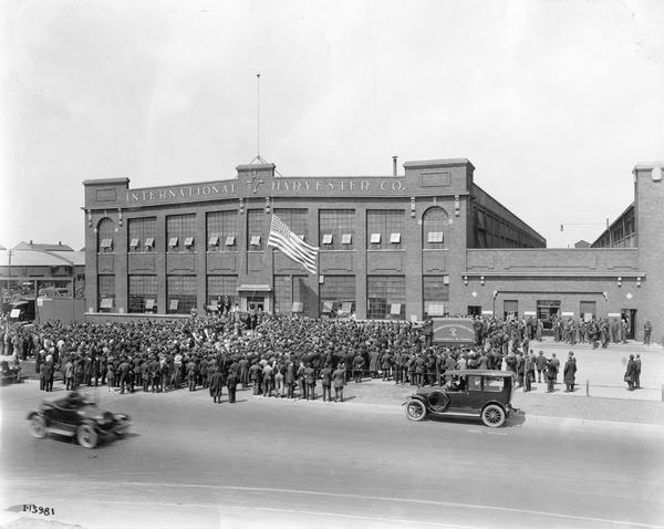 Crowd gathered outside International Harvester's Tractor Works for the raising of an American flag. The factory was located at 2600 West 31st Blvd., and was in operation from 1910 to 1972.