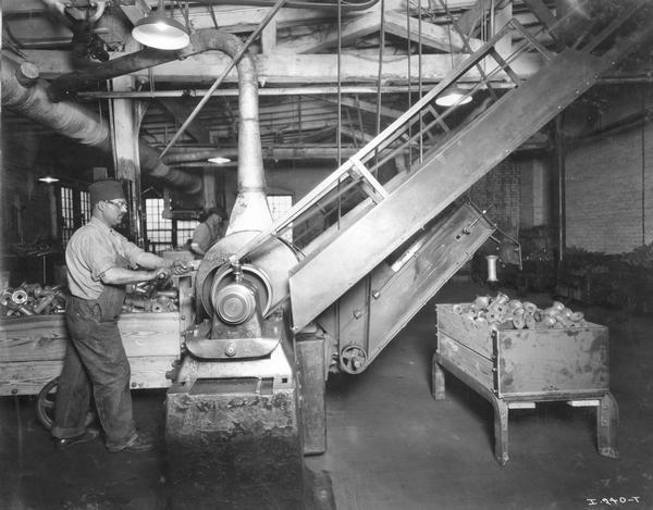Factory worker machining implement parts at International Harvester's Rock Falls Works. The factory was owned by the Keystone Manufacturing Company until 1904, when the company was purchased by International Harvester. The factory was known as the "Keystone Works" until 1920.