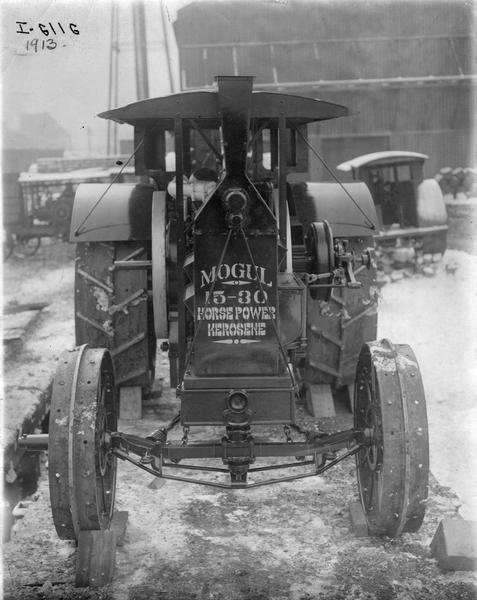 Mogul 15-30 HP kerosene tractor loaded on a railroad car for delivery, most likely outside International Harvester's Tractor Works.