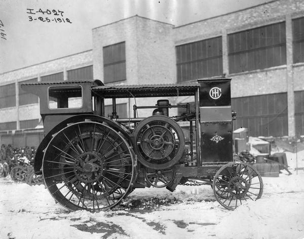 Mogul 25 HP tractor outside International Harvester's Tractor Works.